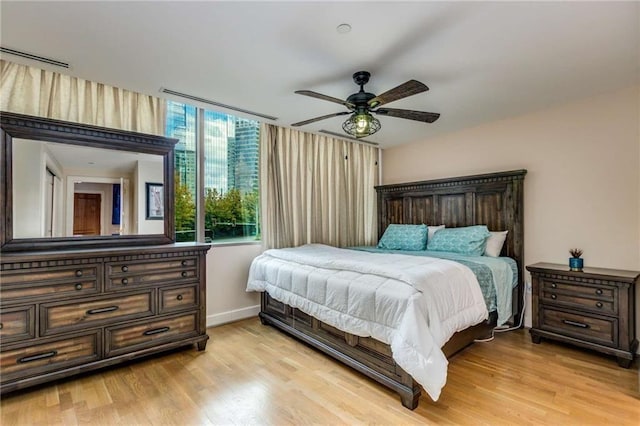 bedroom featuring ceiling fan and light hardwood / wood-style floors