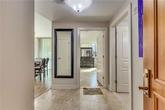 hallway featuring light tile patterned floors