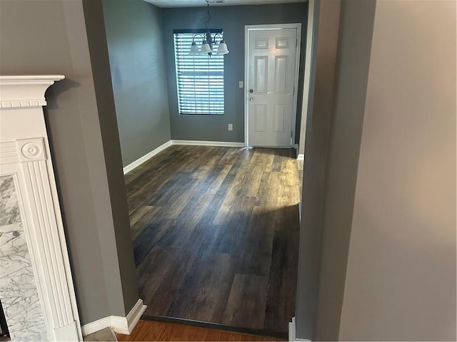 5768 Windgate Ln, Lithonia, GA 30058 - entrance foyer featuring dark wood finished floors and a chandelier