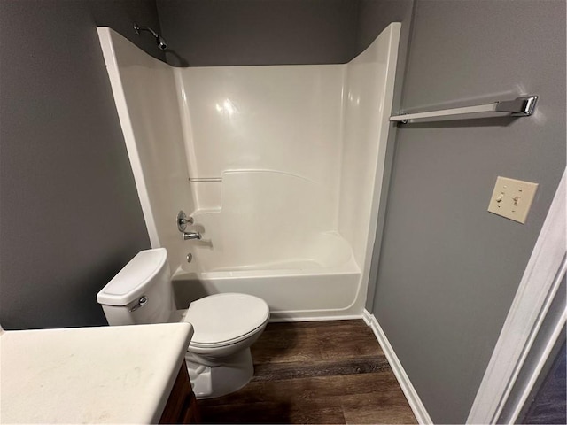 5768 Windgate Ln, Lithonia, GA 30058 - full bath with vanity, wood finished floors, and washtub / shower combination