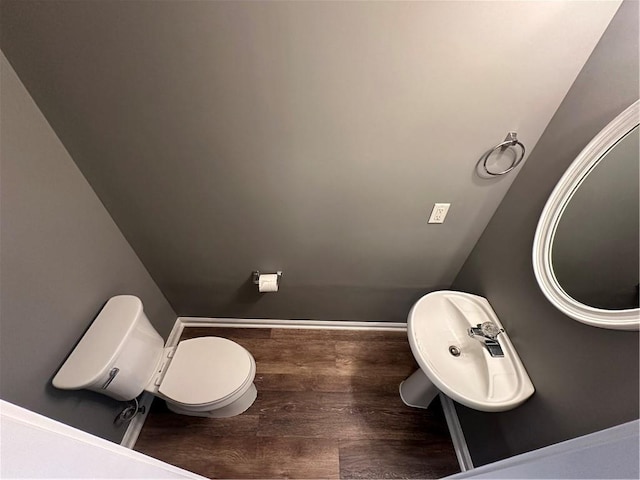 5768 Windgate Ln, Lithonia, GA 30058 - half bathroom with toilet and wood finished floors