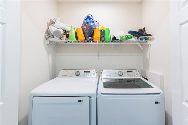 laundry room with laundry area and separate washer and dryer