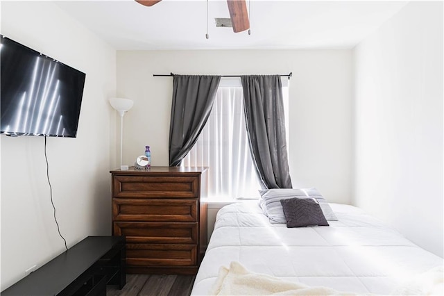 bedroom with ceiling fan and wood finished floors