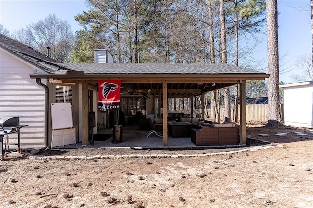 view of patio featuring area for grilling, outdoor lounge area, and fence