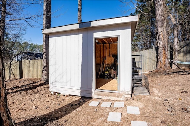 view of shed featuring a fenced backyard