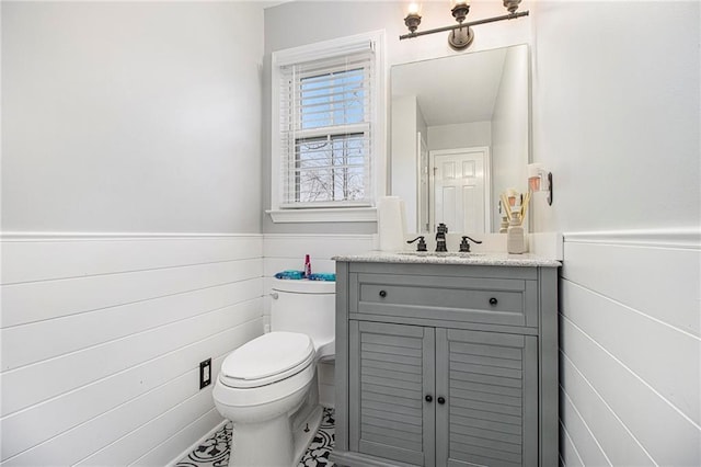 bathroom with vanity and toilet