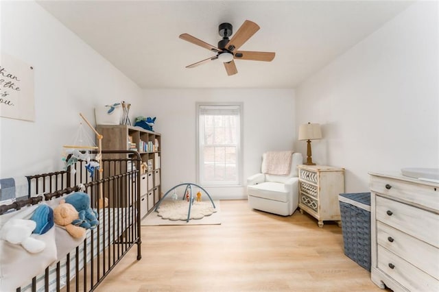 bedroom featuring light wood finished floors and ceiling fan