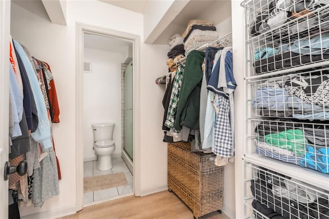 spacious closet with wood finished floors and visible vents