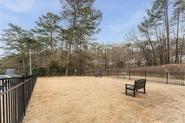 view of home's community with fence