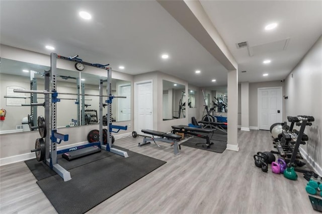 gym with recessed lighting, visible vents, baseboards, and wood finished floors