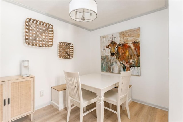 dining room with wood finished floors and baseboards