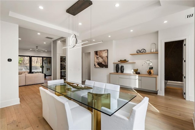 dining area featuring light hardwood / wood-style flooring and ceiling fan