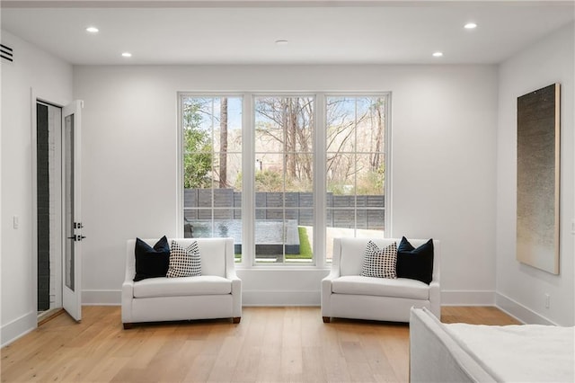 sitting room featuring light hardwood / wood-style floors