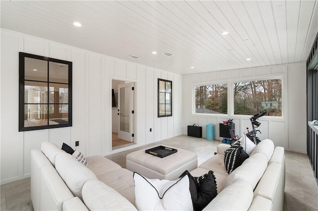 living room featuring light tile patterned floors and wooden ceiling