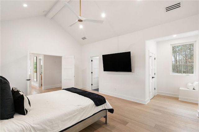 bedroom with ceiling fan, high vaulted ceiling, beam ceiling, and light hardwood / wood-style flooring