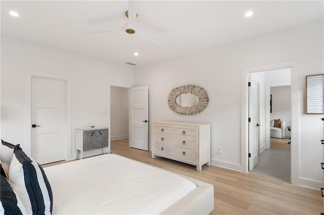 bedroom featuring ceiling fan and light hardwood / wood-style floors