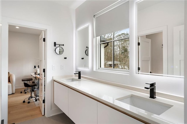 bathroom with vanity and hardwood / wood-style floors