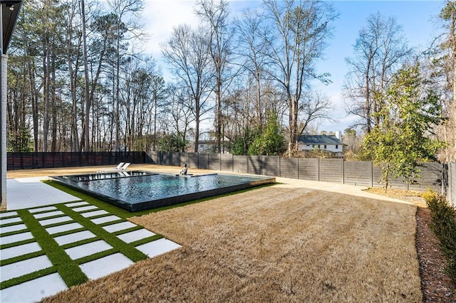 view of swimming pool featuring a patio, a diving board, and a lawn