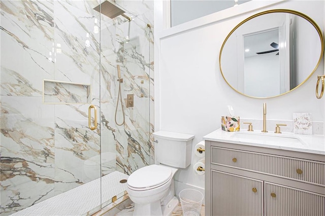 bathroom featuring toilet, vanity, and an enclosed shower