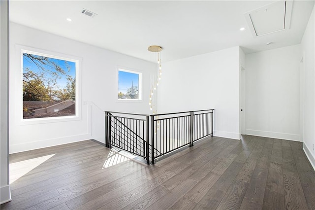 empty room with dark hardwood / wood-style floors