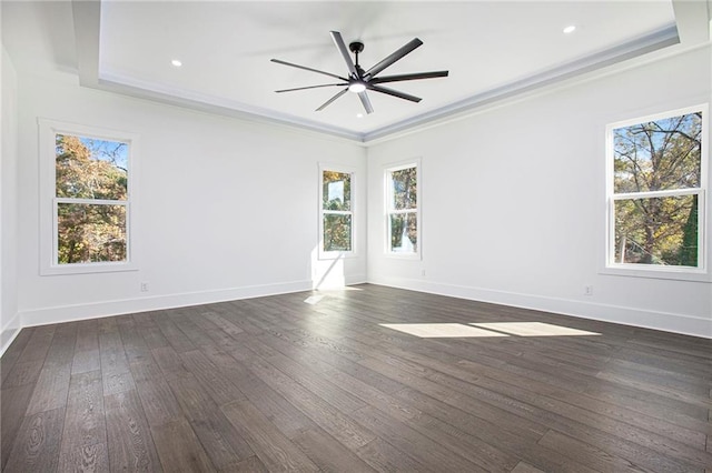 unfurnished room featuring ceiling fan, dark hardwood / wood-style floors, and crown molding