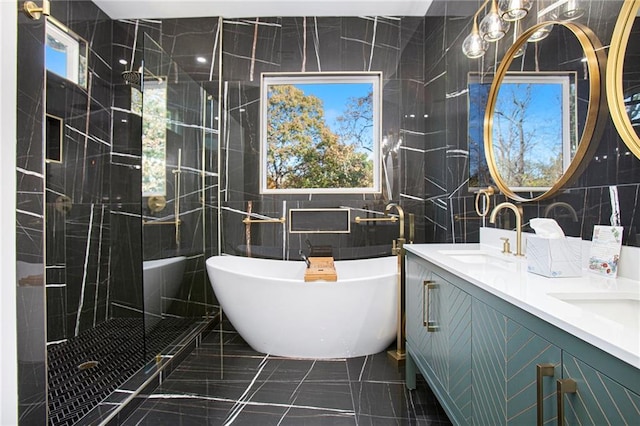 bathroom with vanity, separate shower and tub, and tile walls