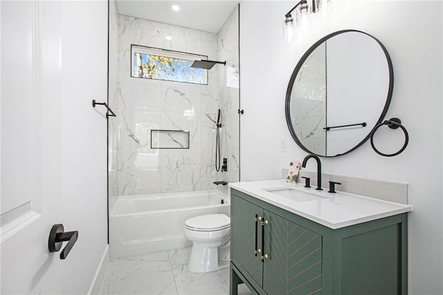 full bathroom featuring toilet, vanity, and tiled shower / bath