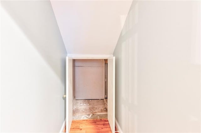 hall with wood-type flooring