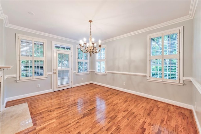 unfurnished dining area featuring crown molding and plenty of natural light