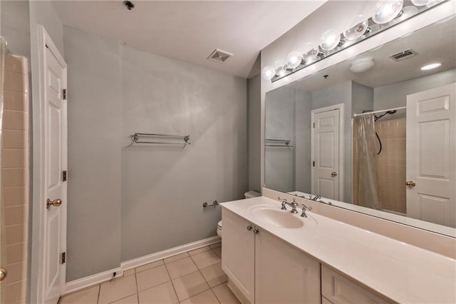 bathroom with a shower with curtain, tile patterned floors, toilet, and vanity