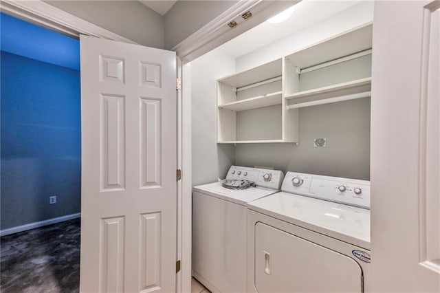 washroom with washing machine and dryer and carpet