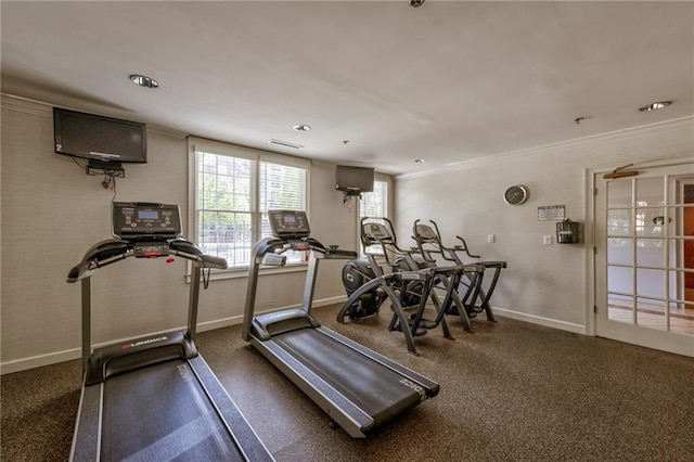 workout room featuring ornamental molding