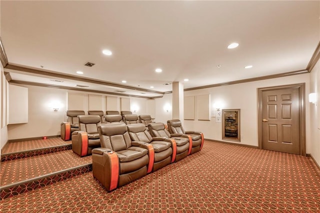 cinema featuring crown molding and carpet flooring