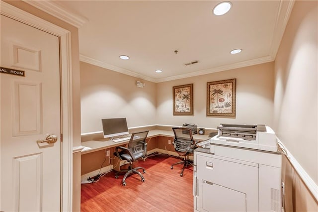 home office featuring ornamental molding and light hardwood / wood-style floors