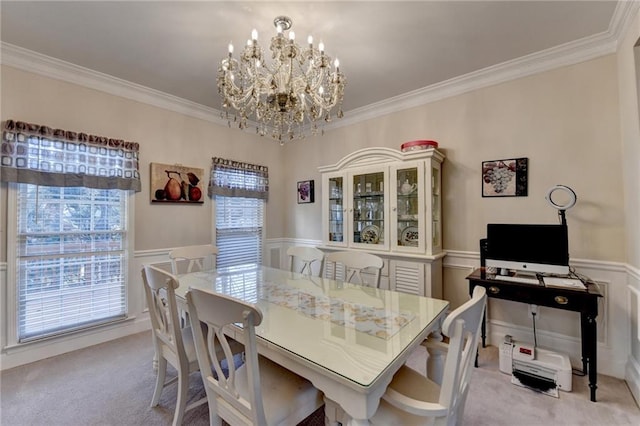 carpeted dining space with crown molding, plenty of natural light, and an inviting chandelier