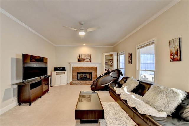 carpeted living room with crown molding, ceiling fan, and a fireplace