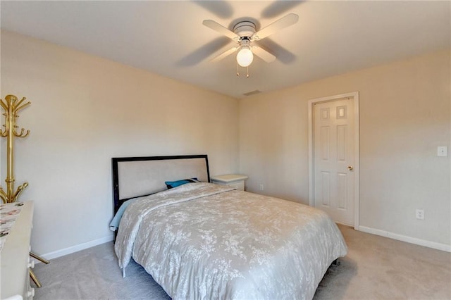 bedroom featuring light colored carpet and ceiling fan