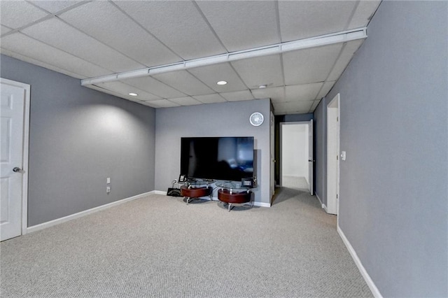 interior space with carpet floors and a drop ceiling