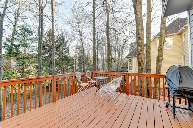 wooden terrace featuring grilling area