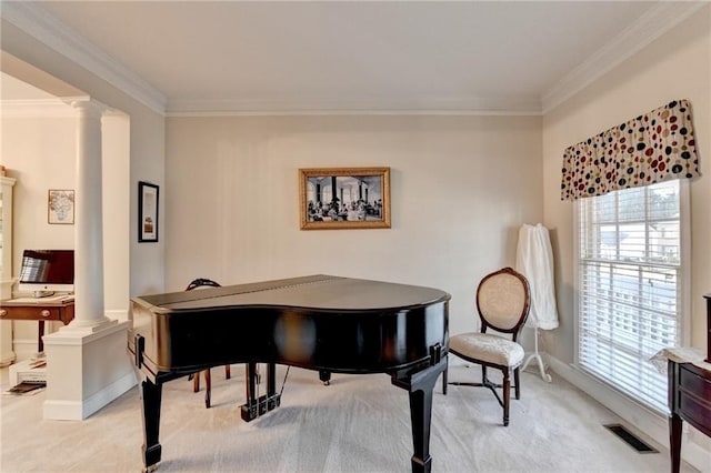 misc room with decorative columns, crown molding, and light carpet