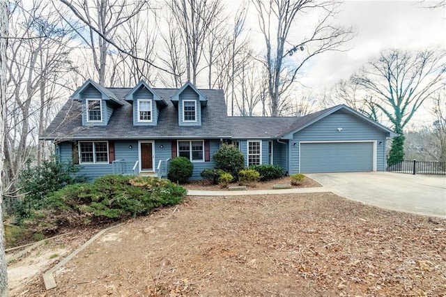 new england style home featuring a garage