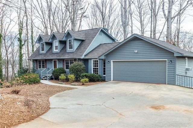 cape cod-style house featuring a garage