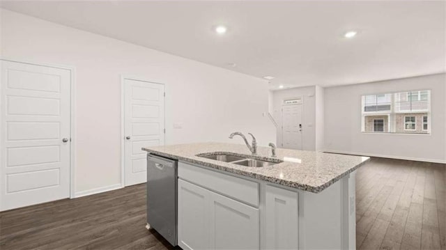 364 Sound Cir, Stockbridge, GA 30281 - kitchen with dishwasher, a kitchen island with sink, dark wood-style flooring, light stone counters, and recessed lighting