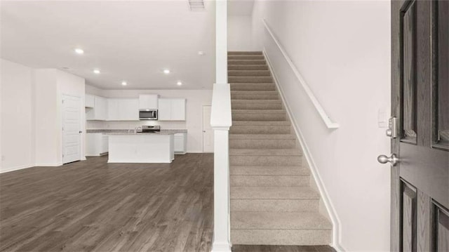 364 Sound Cir, Stockbridge, GA 30281 - stairs with recessed lighting and wood finished floors