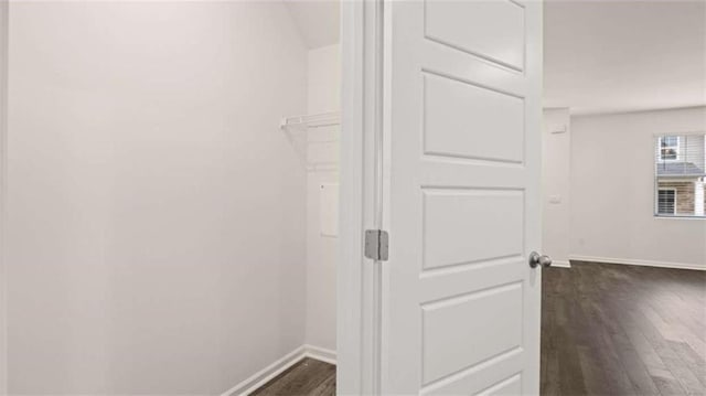 364 Sound Cir, Stockbridge, GA 30281 - hall with baseboards and dark wood-type flooring