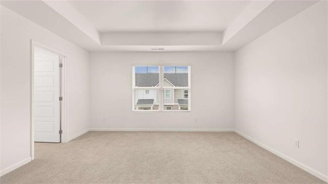 364 Sound Cir, Stockbridge, GA 30281 - unfurnished room featuring light carpet and a tray ceiling