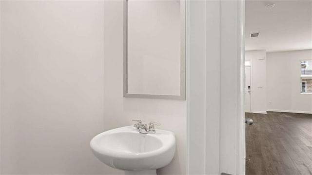 364 Sound Cir, Stockbridge, GA 30281 - bathroom featuring a sink and wood finished floors