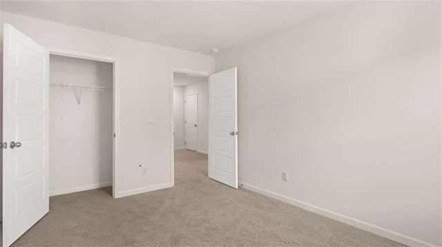 364 Sound Cir, Stockbridge, GA 30281 - unfurnished bedroom featuring carpet floors and a closet