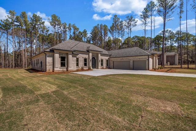 125 Drummond Pl, Covington, GA 30014 - french provincial home featuring an attached garage, concrete driveway, a front yard, and brick siding