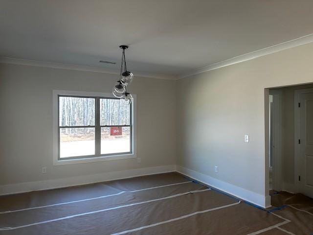 unfurnished dining area with crown molding and baseboards